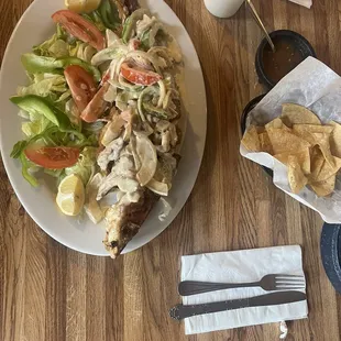 Bagre a la Casa. Catfish with special house sauce. Sauce contains bell peppers, tomatoes, onions, and mushrooms