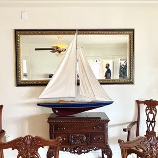 The antique ship in the formal dining room (from local shops "Restyle Market / Encore Décor".)