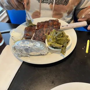 BBQ ribs, collards, and baked potato