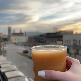 a person holding a cup of coffee