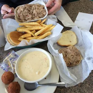 Large BBQ Tray w/ fries and hushpuppies, Bowl of Potato Soup, Chopped Bar-B-Cue Sandwich, sauce, and slaw