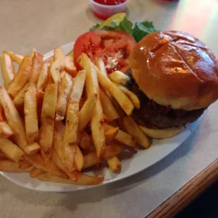a hamburger and fries on a plate