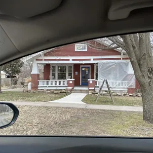 a red house with white trim