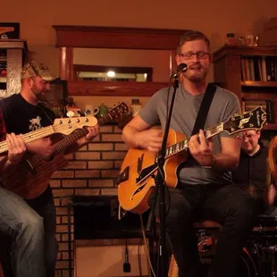 a group of men playing guitars