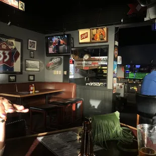 a man sitting at a table in a sports bar