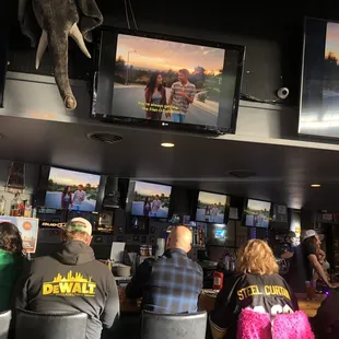 a large group of people watching televisions