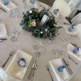 Setting up linen, silverware and favors marking sure everything looks nice and neat