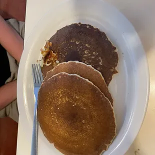 Stack of pancakes, side of bacon is not pictured