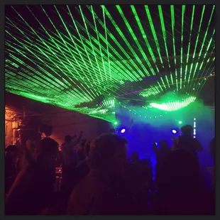 a group of people dancing in a club