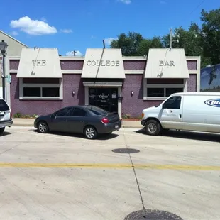 cars parked in front of the college bar