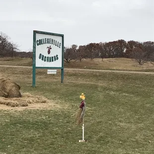a sign in the middle of a field