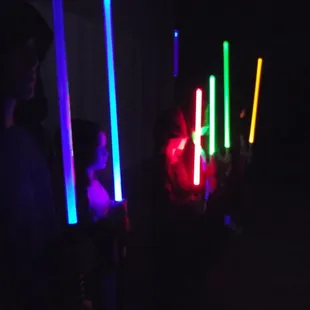 Wielders of light sabers at jedi training camp.