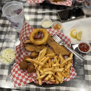 Catfish plate included three pieces of fried catfish with fries, hush puppies, slaw, tartar sauce, and ketchup.