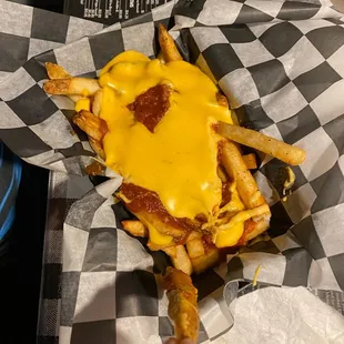 a hand holding a cheeseburger