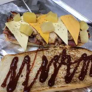 two sandwiches with ketchup and cheese