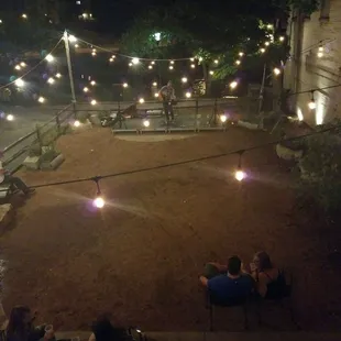 people sitting outside at night