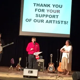 a group of people standing on a stage