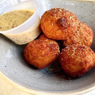 Sauerkraut Balls with roasted pork, cream cheese, beer mustard sauce
