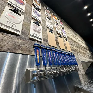 a wall of beer taps