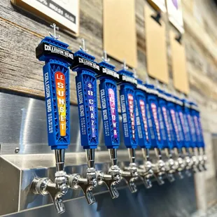 a row of beer taps