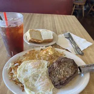 6oz sirloin steak, hash browns, 2 eggs over medium, sour dough toast and plain iced tea.