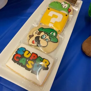 Yoshi, mystery box, Luigi &amp; my son's name in Mario font.