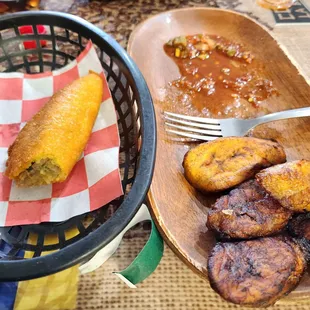 a basket of food and a plate of fried bananas