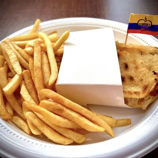 Beef and ham stuffed Arepa with fries