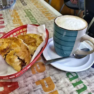 You should definitely try their Empanadas de &quot;Carne con Pasas&quot; and hot chocolate.