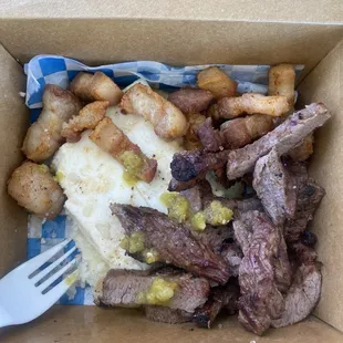 Arepa with cheese steak and chicharrón