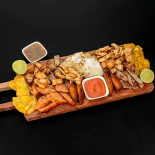 Picada Mixta.
Steak, grilled chicken, crispy pork cracklings, Colombian chorizo, and blood sausage, served with cheese arepa