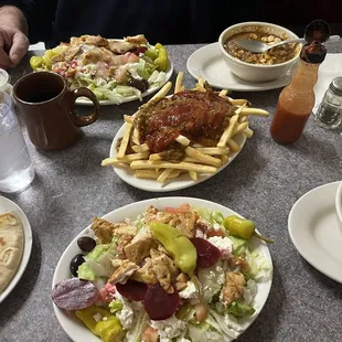 Chicken Greek Salad, Chili Fries, Bowl of Chili smothered in hot sauce and onions, along with pita bread.