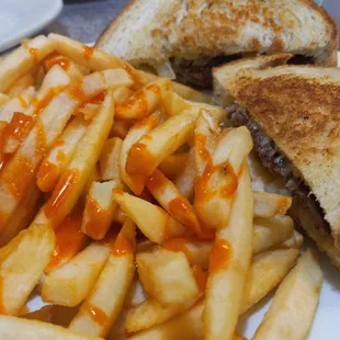 a grilled cheese sandwich and french fries