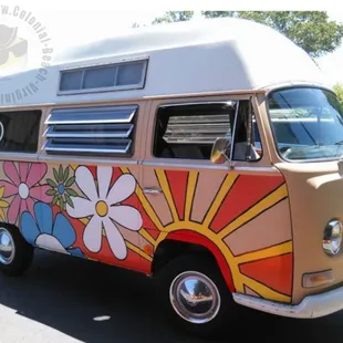 an old vw bus painted with flowers