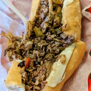 a sandwich with meat and vegetables