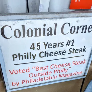 a sign for a cheese steak