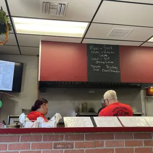 two people sitting at the counter