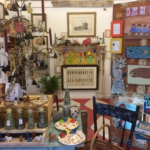 Vintage folk art, antiquated books, antique maps and modern outsider art together? Yep! It works.