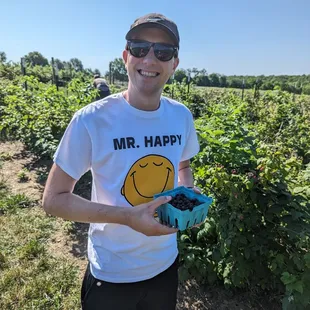 a man in a mr happy t - shirt