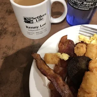 a plate of food and a cup of coffee