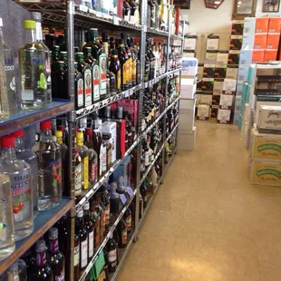 a wide aisle of liquor bottles