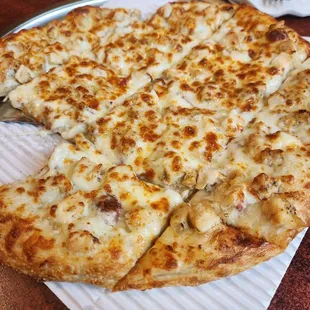 a cheese pizza on a serving tray