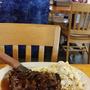 steak with gravy and mashed potatoes