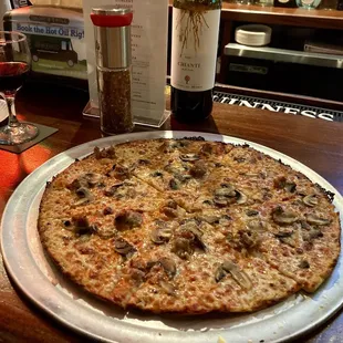 Sausage and mushroom pizza. Brought our own Flatiron pepper grinder.