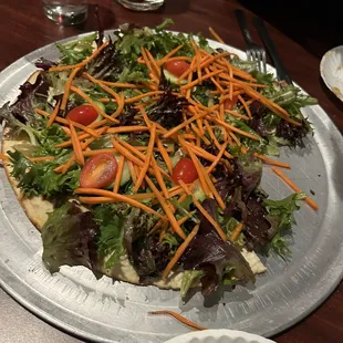 Salad pizza. It was like a toasted pita bread with a house salad on top