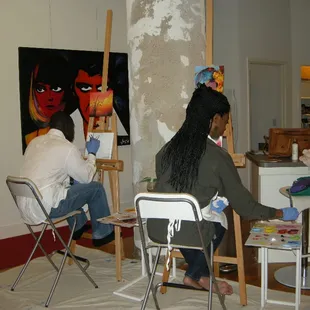 Artist Steve and Mary painting on date night