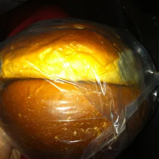 a loaf of bread wrapped in plastic