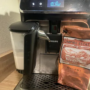 a coffee maker and a bag of coffee