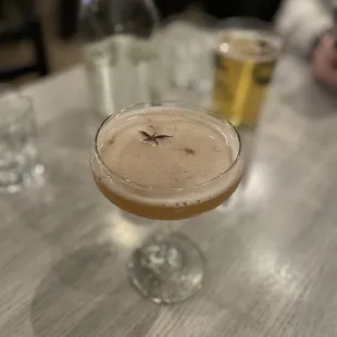 a cocktail in a coupe glass