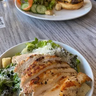 Caesar salad with grilled chicken and craft burger